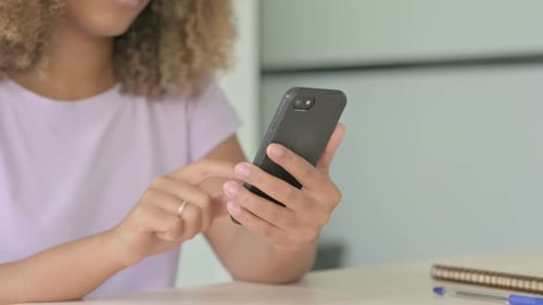 Close Up of African Woman Using Smartphone