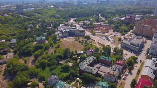 Aerial View of a Summer Green City Sleeping Area Clip Ordinary Houses and Streets with Park Zones