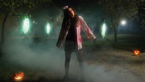 Zombie Woman Moves In Forest On Foggy Halloween Night