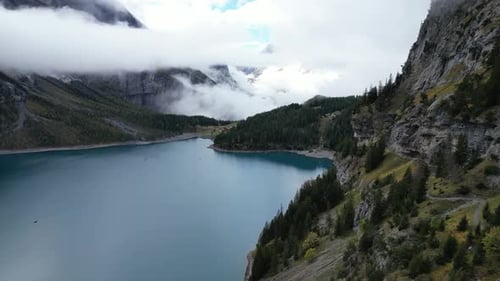 Aerial view of serene lake and mountains, Switzerland.