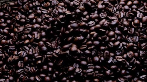 Roasted Coffee Beans Filling Frame Falling from Above