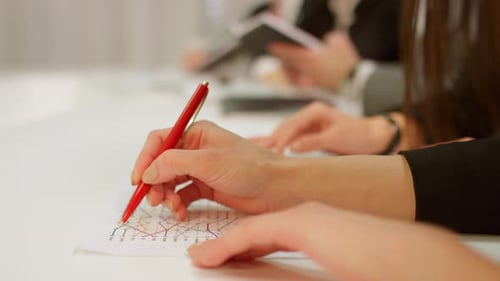 Business Professional Reviewing Documents During Meeting – Close-Up of Hands