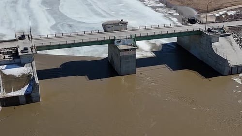 Red River Floodway Gates Winnipeg Manitoba Canada Aerial Drone Push In Orbit Right Spring Breakup