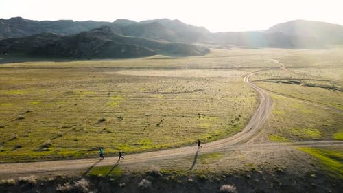 Drone Shot Runners Near River Ili in Kazakhstan