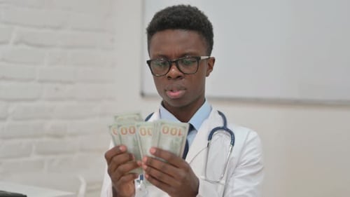 Doctor Counting Cash in the Hospital