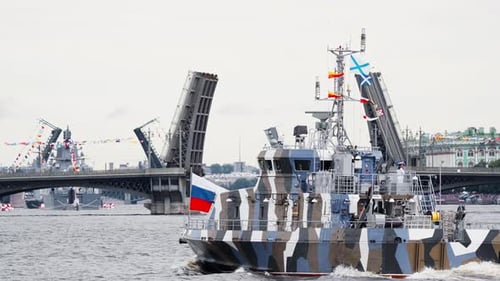 A Lot of Warships Goes Along the Neva River Under Open Bridges at the Time of the Rehearsal of the