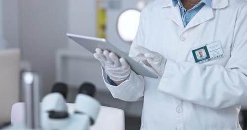 Scientist Using Tablet in Modern Laboratory