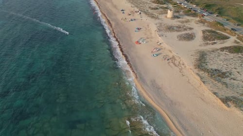 Kitesurfers Enjoying a Windy Day on a Sandy Beach – Aerial View