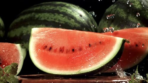 Drops of Water Fall on a Piece of Watermelon Filmed on a Highspeed Camera at 1000 Fps