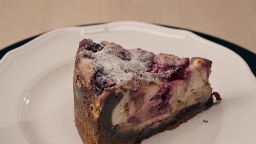A dessert close-up of a piece of delicious cake lying on a white plate in an Italian restaurant