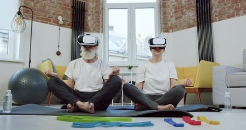 Seniors Meditating at Home Wearing VR Headsets