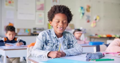 Smile, education and writing with boy in classroom for learning, knowledge and study