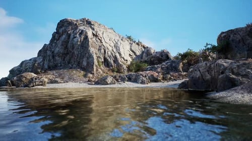 Rocky Shoreline with Calm Waters Reflecting a Clear Blue Sky