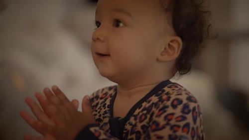 Happy Infant Clapping Hands Close Up Indoors