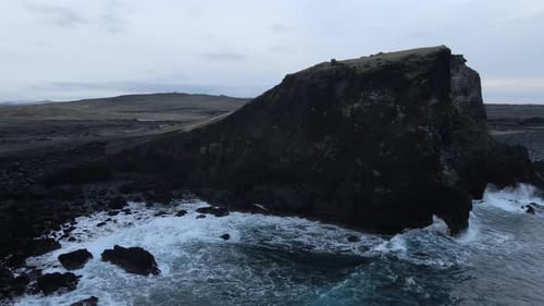 Aerial Seascape South Coast of Iceland. Waves Crashing to Black Rocks on Shore