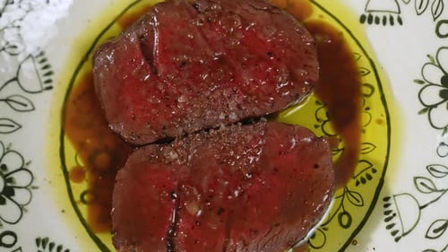 Grilled Steaks Cooked to State of Medium Rare on Plate