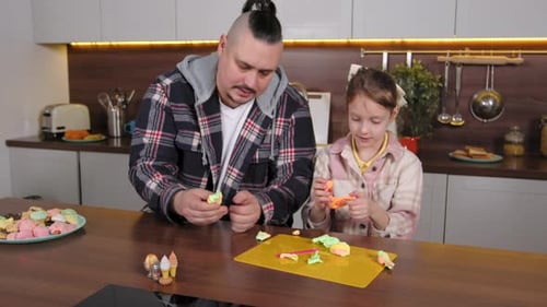 Cute School Age Girl and Father Molding From Colorful Play Clay at Home