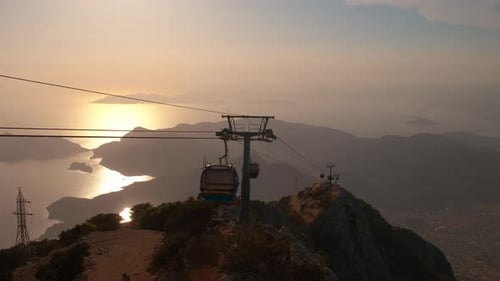 Scenic Mountain Landscape With Golden Hour Cable Cars
