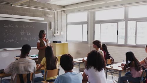 Teacher Explaining Math Lesson to Class
