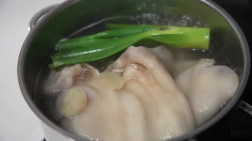 Boiling Meat with Ginger and Scallions in Pot