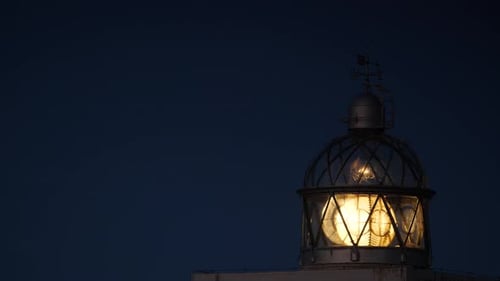 Lighthouse With Beacon Light In The Night