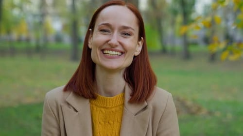 Smiling Woman in Autumn Park Close Up
