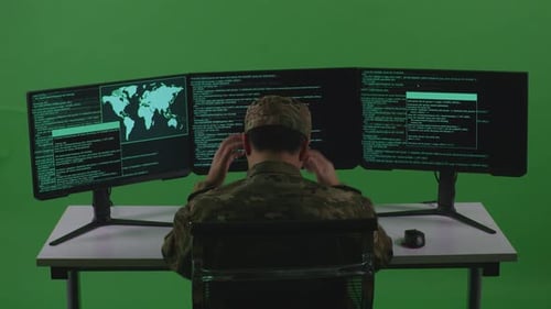 Asian Man Soldier Having Headache While Write Code With Multiple Screens In Green Screen