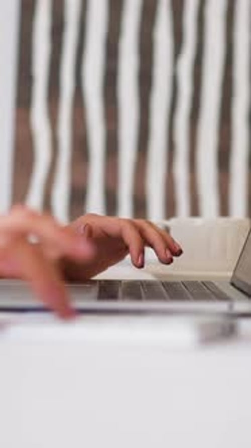 Woman Makes Calculations on Numeric Keypad at Office