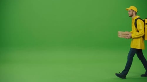 Green Screen Delivery Man in Yellow Uniform With Thermal Backpack Brings Pizza