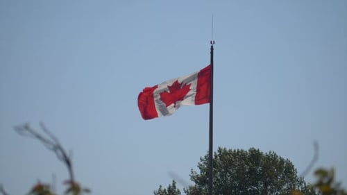 Canadian Flag Waving Proudly in the Wind