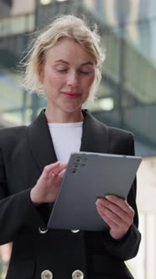 Businesswoman Using Tablet Device in an Urban Environment