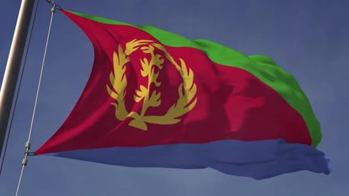 Eritrea National Flag Waving on Flagpole with Blue Sky