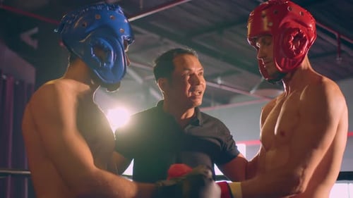 Two young professional boxer having a competition tournament on stage.