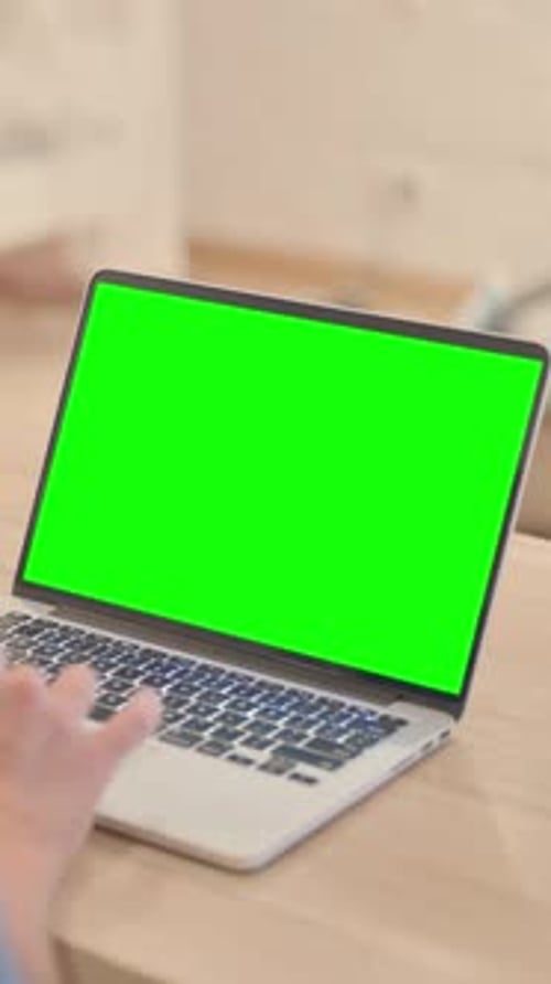 Mature Man Using Laptop with Chroma Key Screen, vertical video