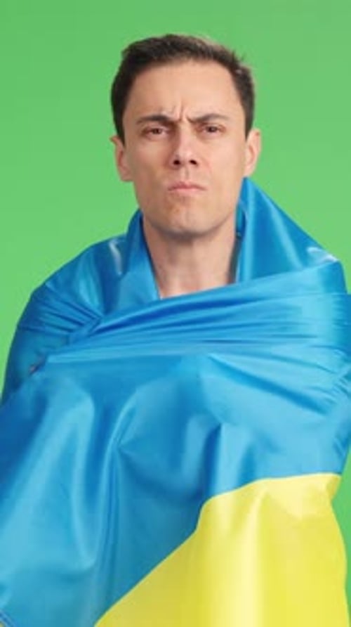 Adult Man Draped with Flag on Green Screen