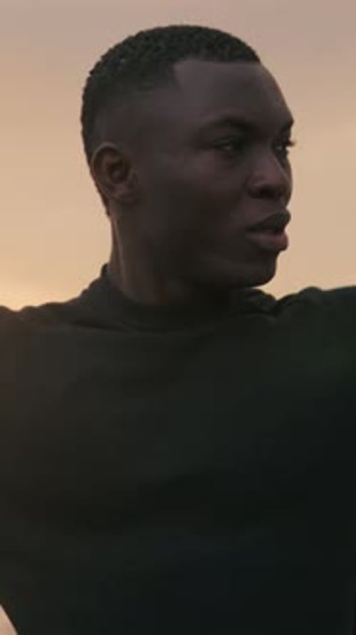 Young man stretching his body, warm up before workout outdoor