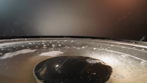 White Coke Powder Falls Onto Water on Dynamic in Apartment