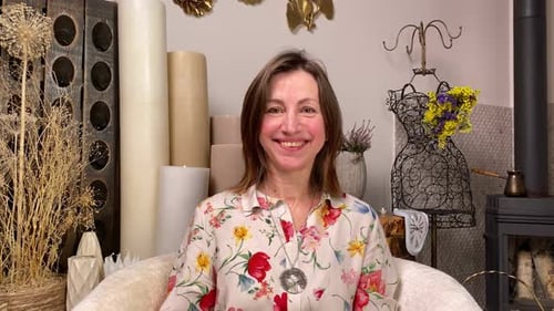 Smiling Woman in Armchair at Home