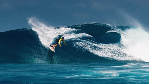 Surfing with Speed Warp Effect Experienced Surfer Rides the Ocean Wave at the Famous Sultans Surf