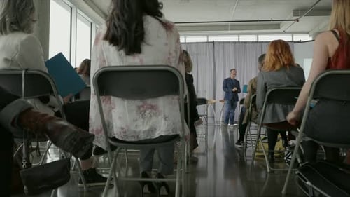 Presentation in modern office with many attendees