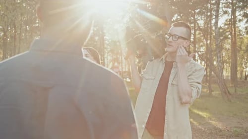 On Location Film Crew Talking in the Sunlight