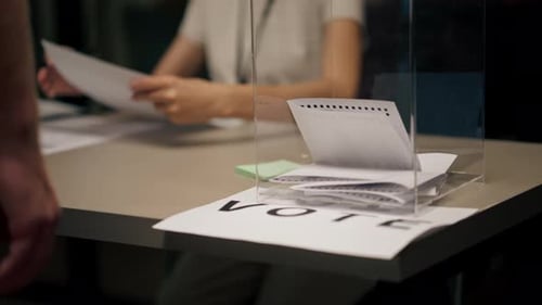 Close Up In the Selection Committee of the Election Company a Guy Registers to Vote a Young Girl