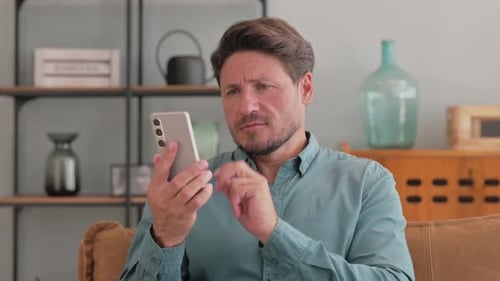 Man Using Smartphone Device in Home Interior