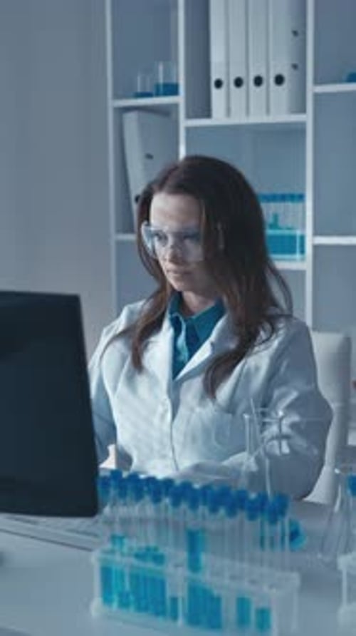 Woman Working in Lab on Computer