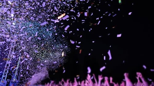 Confetti Bursts at an Outdoor Night Event