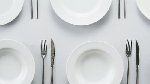 Elegant Table Setting with Plates and Silverware