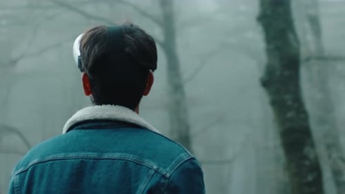 Man Wearing VR Headset in Forest