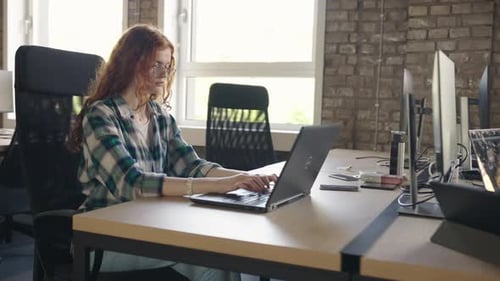 Busy Professionals Collaborating in a Modern Office