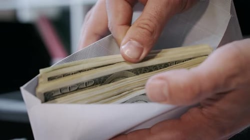 Close Up Of Cash Money In Envelope In Hands. Money Bonus In Paper Envelope. Man Holding Envelope ...