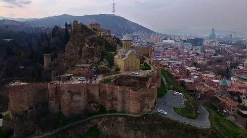 Drone flight over Narikala fortress and old Tbilisi skyline